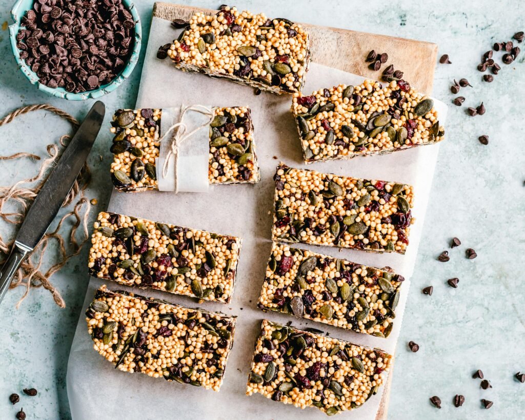 Top view of homemade granola bars with seeds and chocolate chips.