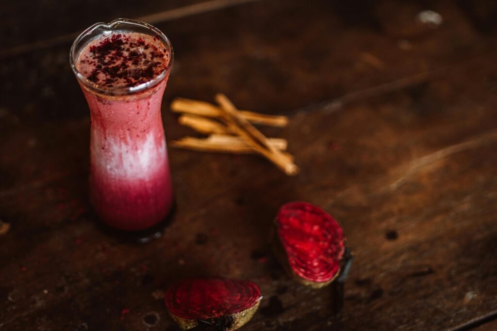 Delicious beetroot and cinnamon smoothie on a rustic table, perfect for a healthy refreshment.